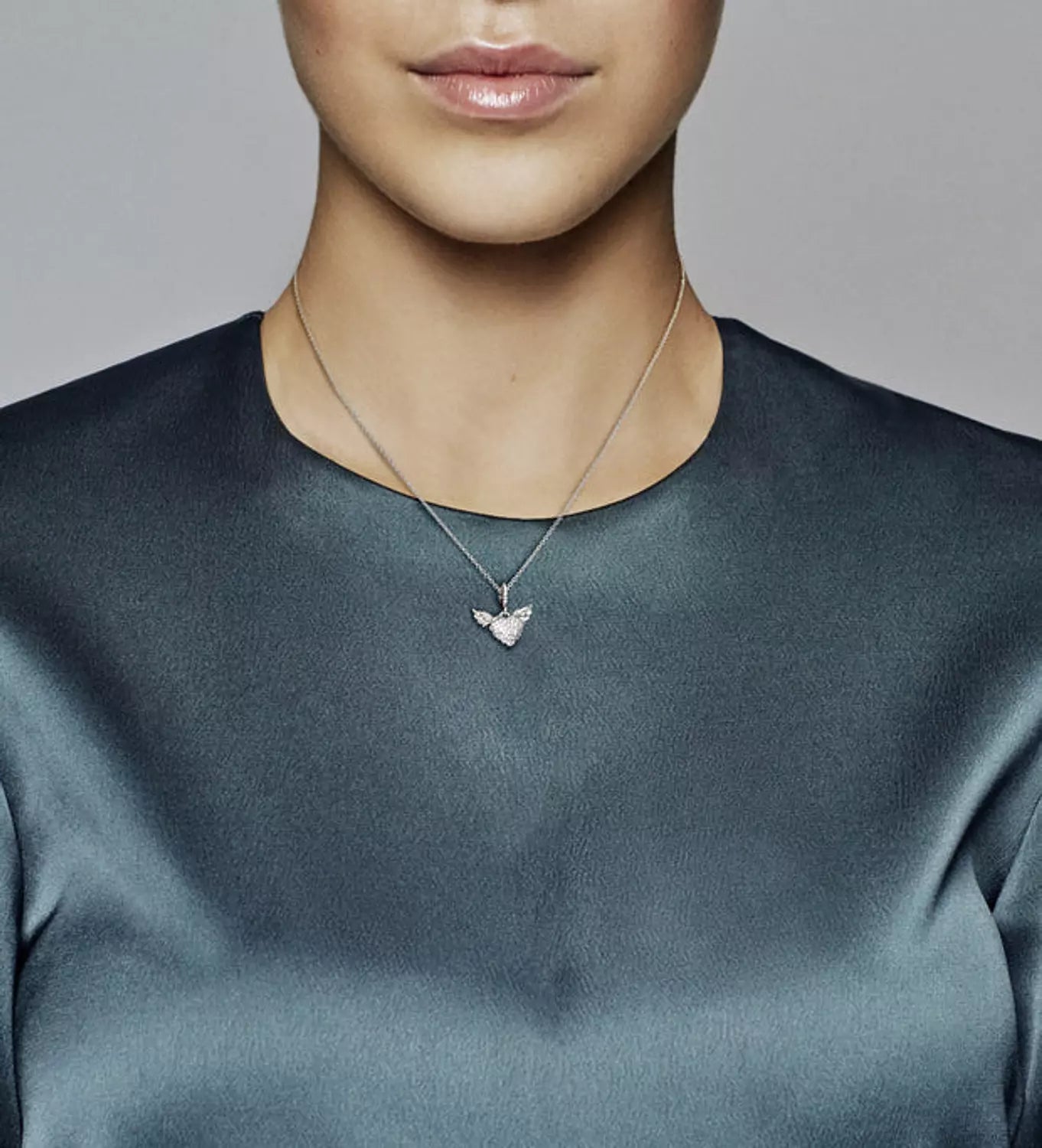 Heart and wings sterling silver pendant with clear cubic zirconia and necklace